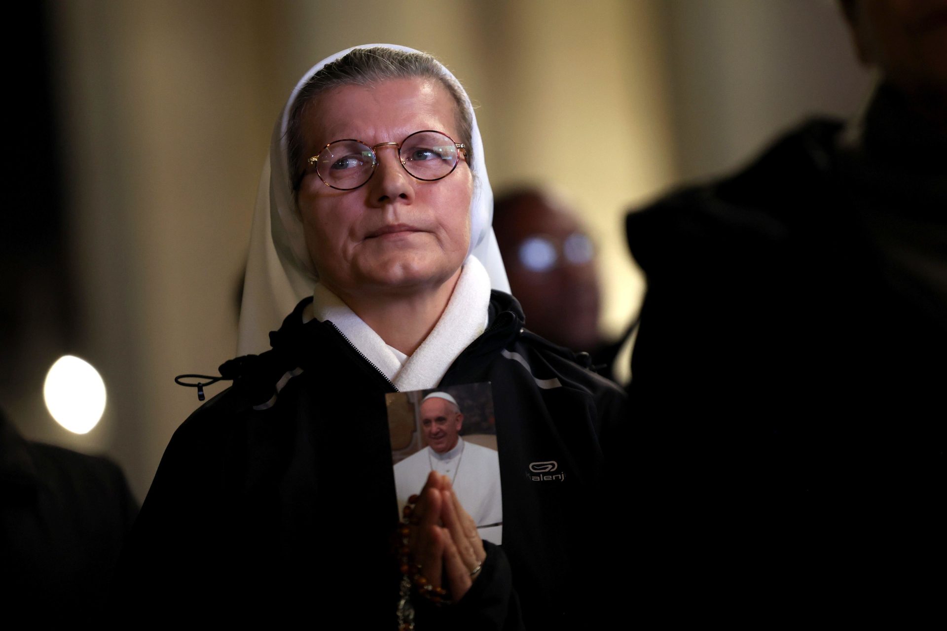 Nun with the image of Pope Francis, on the eighth day, recites the holy rosary to support Pope Francis in St. Peter's Basilica forecourt. Pope hospitalized at the Gemelli Polyclinic for pneumonia. 