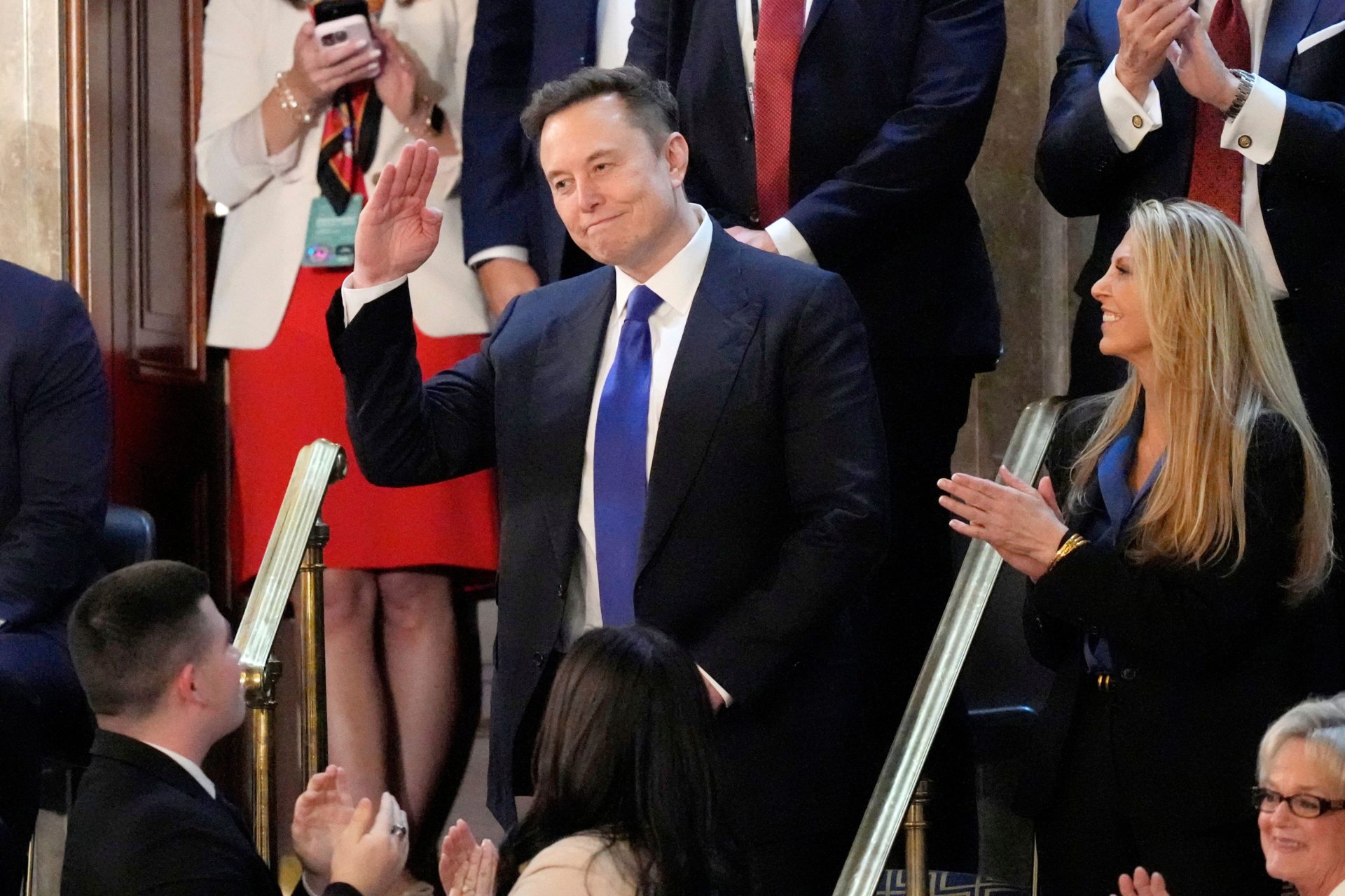 Elon Musk gestures as President Donald Trump addresses a joint session of Congress at the Capitol in Washington.