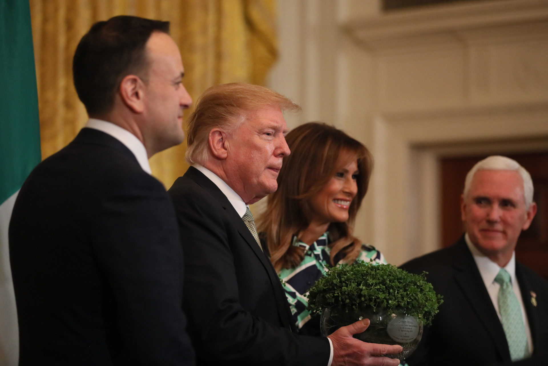 RYMWBK Taoiseach Leo Varadkar presents US President Donald Trump with a bowl of Shamrock, watched by Melania Trump and US Vice-President Mike Pence, during a St Patrick's Day Celebration reception and Shamrock presentation ceremony at the White House in Washington D.C.