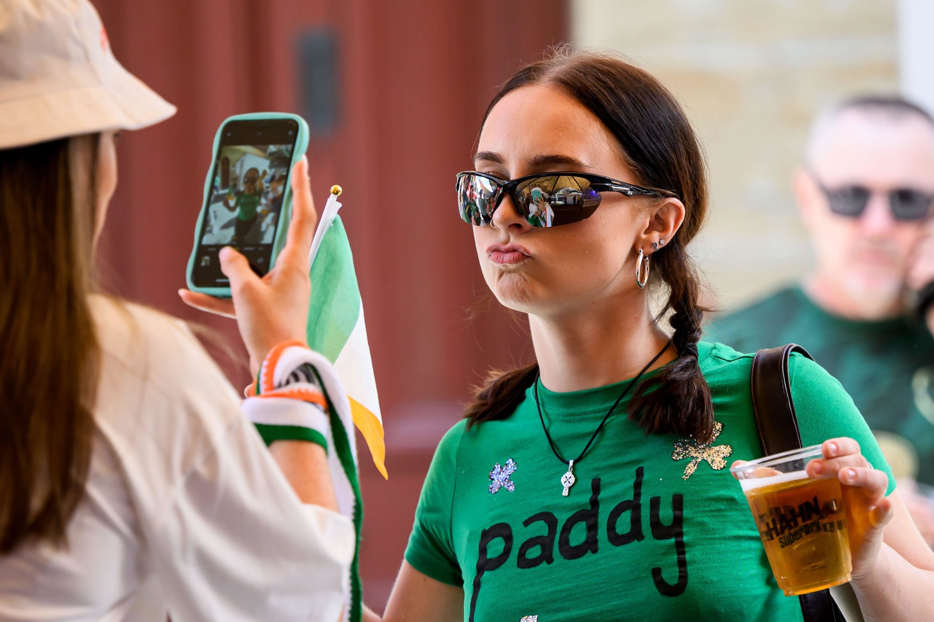 People are seen during Saint Patrick's Day celebrations at The Merc street party in Sydney.