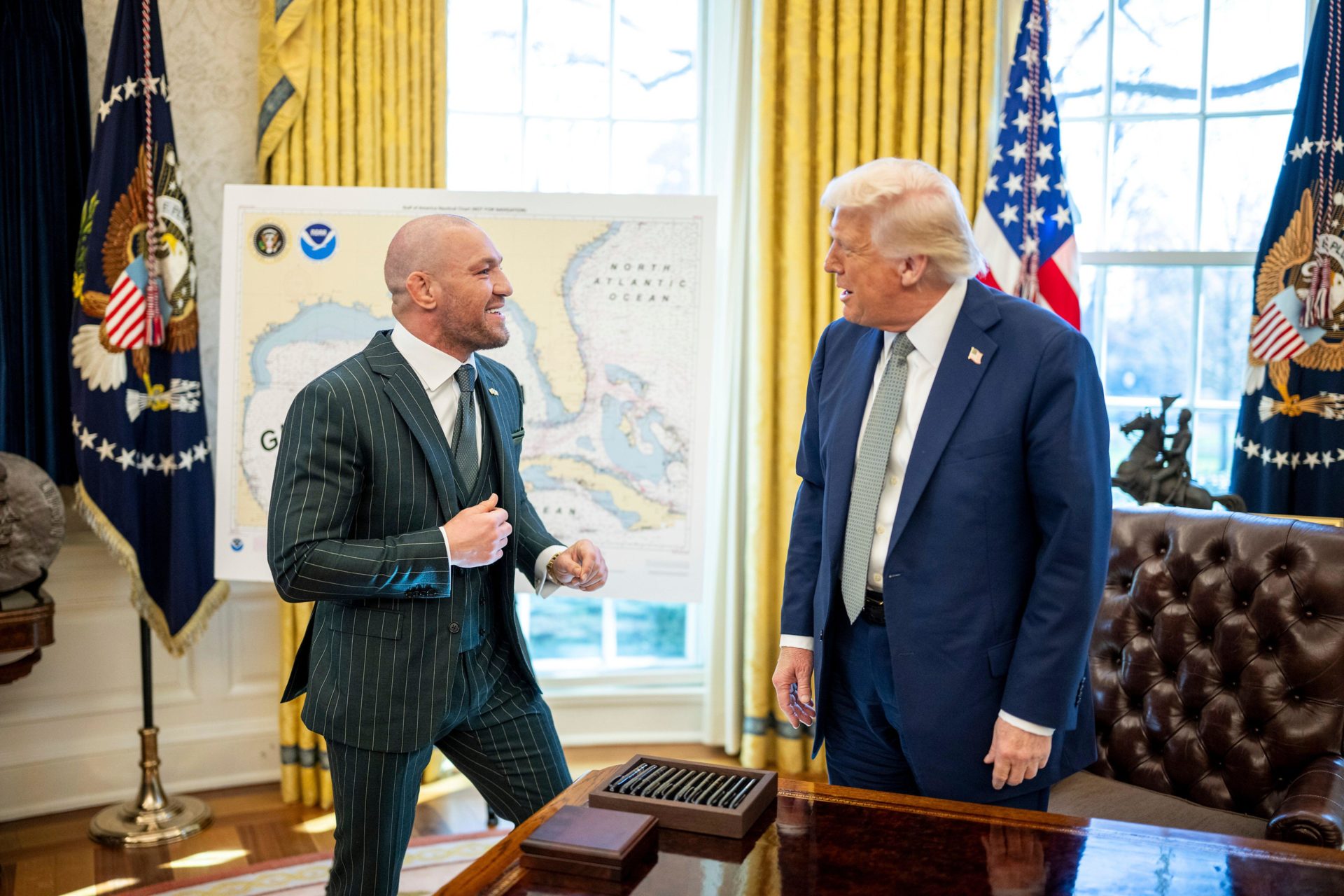 Washington, United States. 17th Mar, 2025. U.S President Donald Trump, chats with Irish MMA fighter Conor McGregor for St. Patricks day, at the Oval Office of the White House, March 17, 2025 in Washington, DC Trump welcomed McGregor who was recently found liable for raping a woman. Credit: Daniel Torok/White House Photo/Alamy Live News