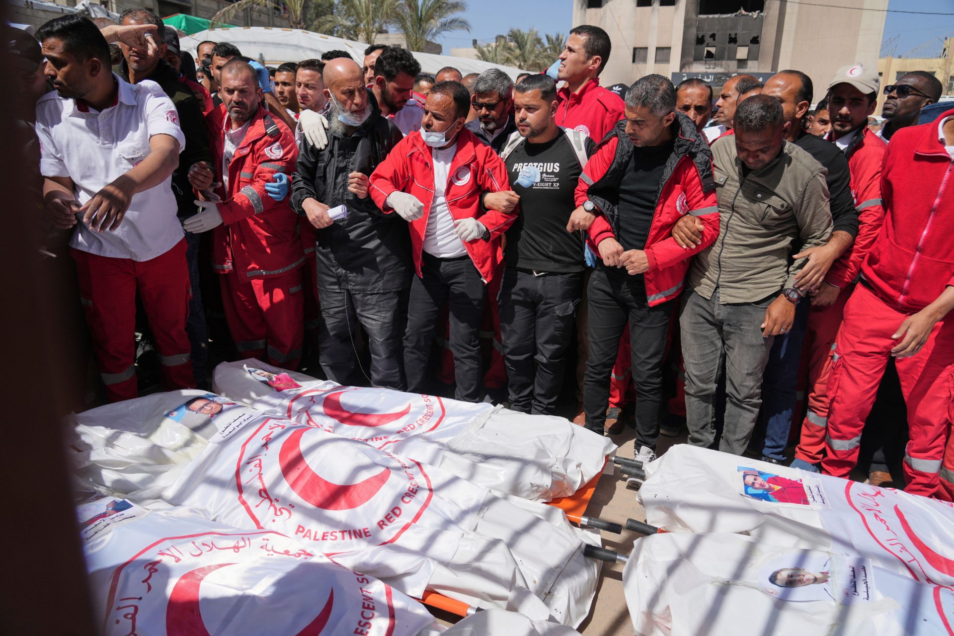 3AD6M8T FILE.- Mourners gather around the bodies of 8 Red Crescent emergency responders, recovered in Rafah a week after an Israeli attack, as they are transported for burial from a hospital in Deir al-Balah, Gaza Strip, on Monday, March 31, 2025. (AP Photo/Abdel Kareem Hana,File)