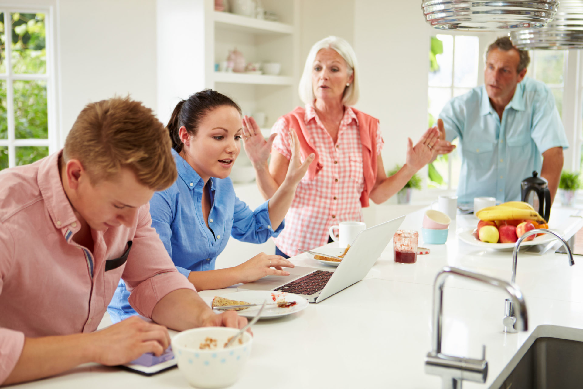 Family Having Argument At Breakfast.