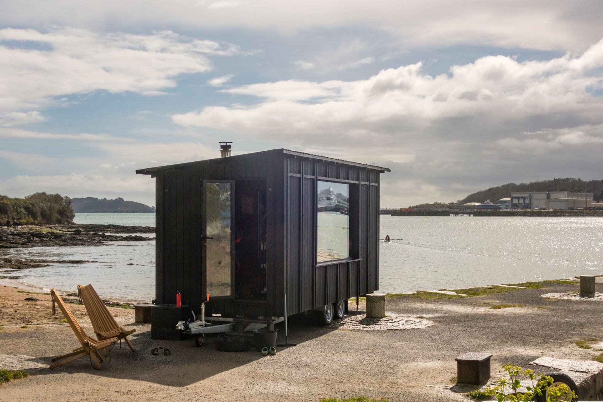 Pop-up wood-fired mobile sauna at Kiln Quay beach, Flushing, near Falmouth, Cornwall, UK.