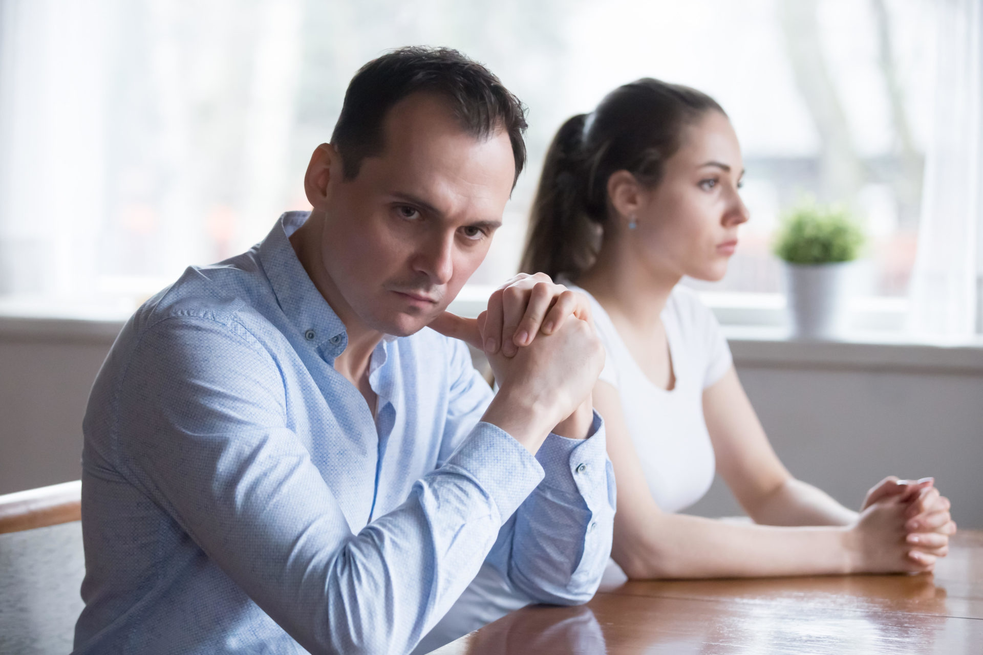 Stubborn couple avoid talking to each other after fight.