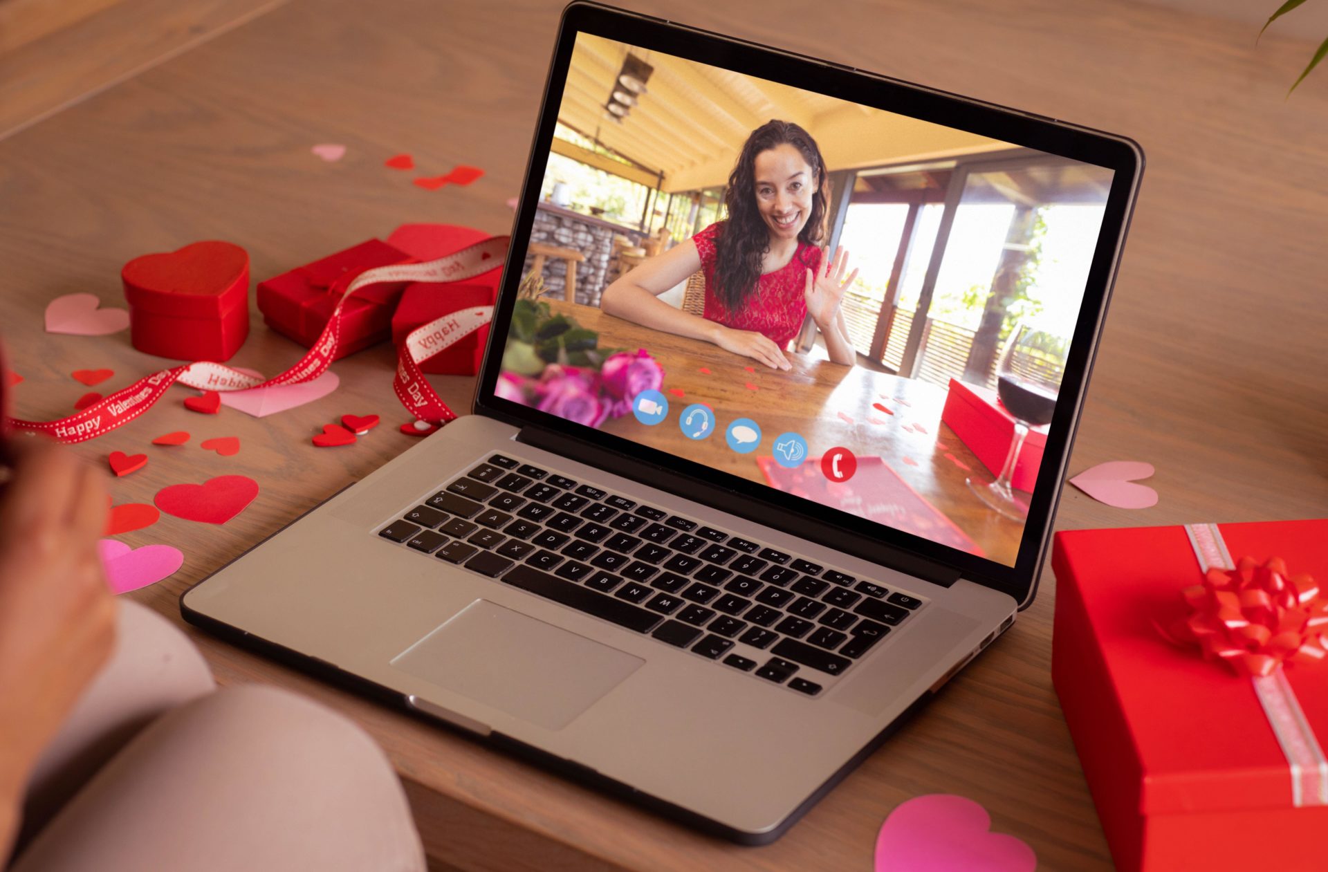 Happy woman waving hand during online dating.