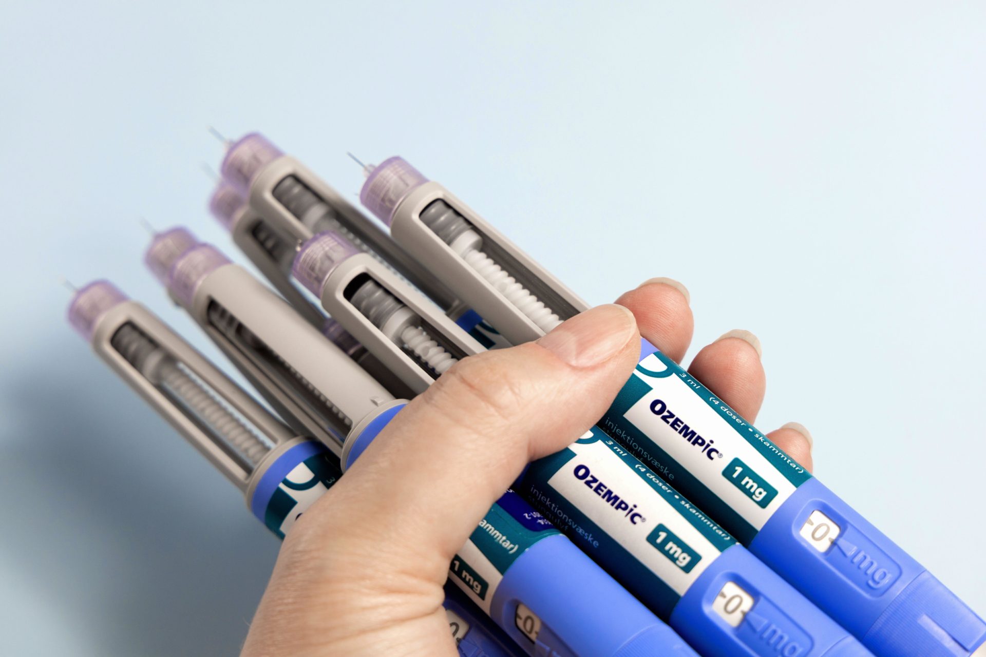 3C3TEAD A woman's hands holds many Ozempic syringe pen with needle. Copenhagen, Denmark - July 27, 2025