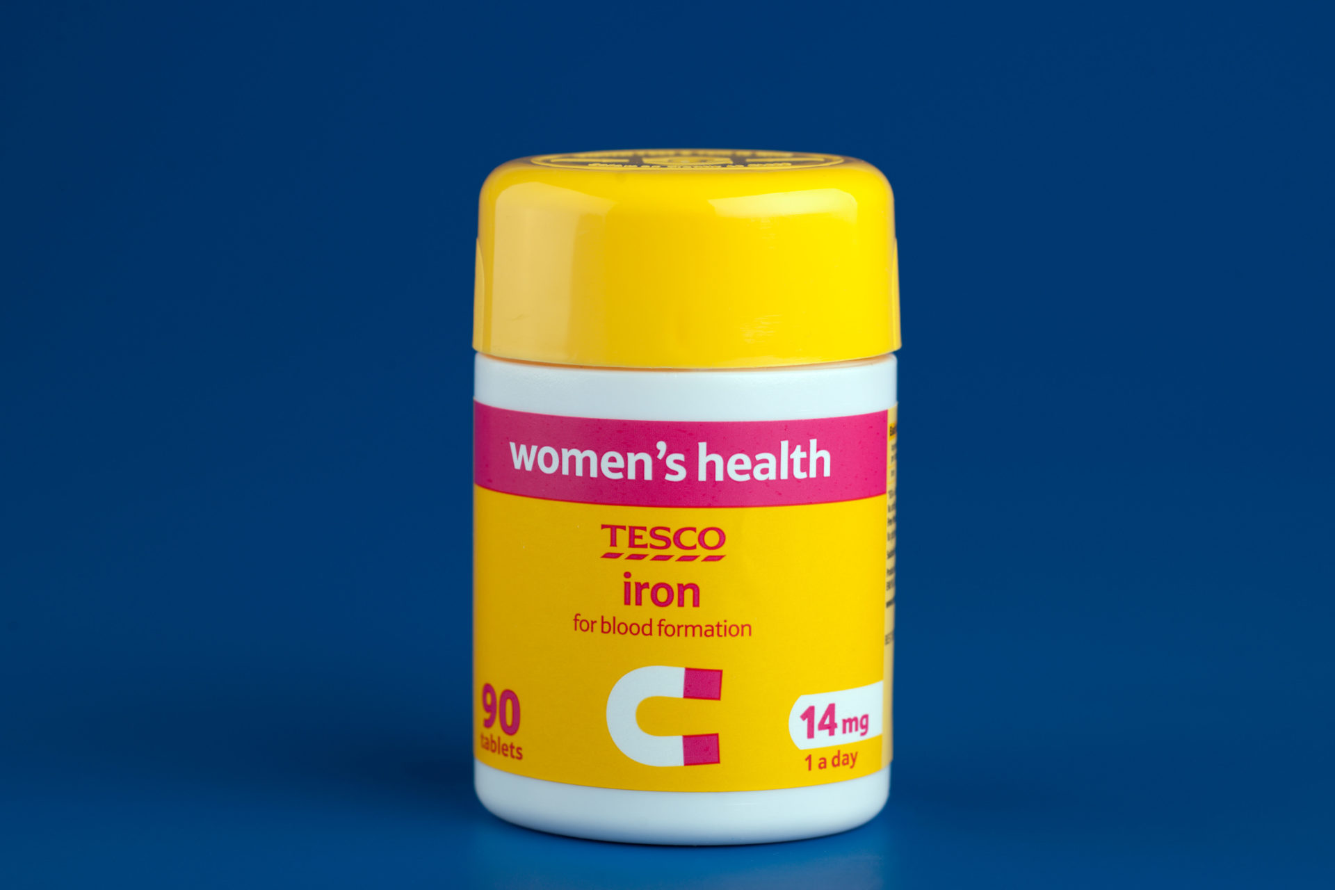 Container of Tesco Womens health 90 vitamin iron supplement tablets.