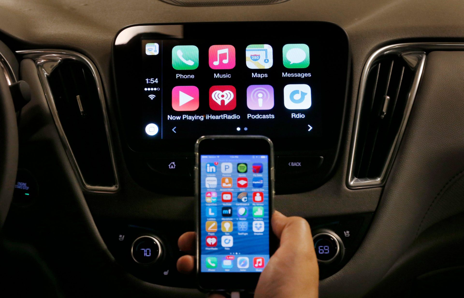 An iPhone is connected to a 2016 Chevrolet Malibu.