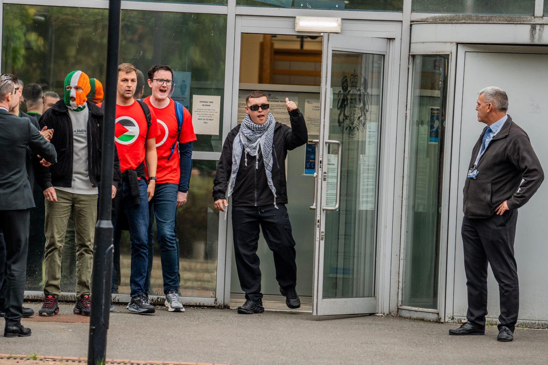 Mo Chara of Belfast rap group Kneecap emerges jubilant from Woolwich Crown Court having been acquitted of terror charges.