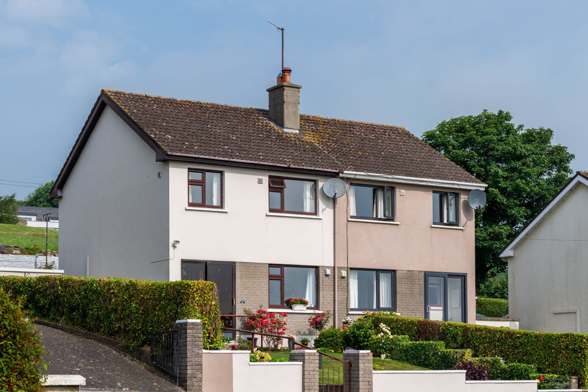 2R95DHE Semi-detached houses on a housing estate in West Cork, Ireland.