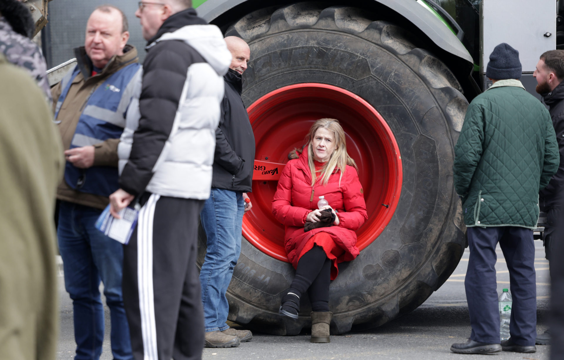11/04/2026 Dublin Irish Leinster Ireland. Day Five of the fuel crisis. Photo shows a woman sitting in a tractor wheel as the farmers who are protesting on O'Connell Street Dublin. A meeting today is taking place aimed at resolving the deadlock between the government and protesters amid nationwide blockades of cities, motorways, fuel depots and fuel refineries. Photo: Leah Farrell/© RollingNews.ie