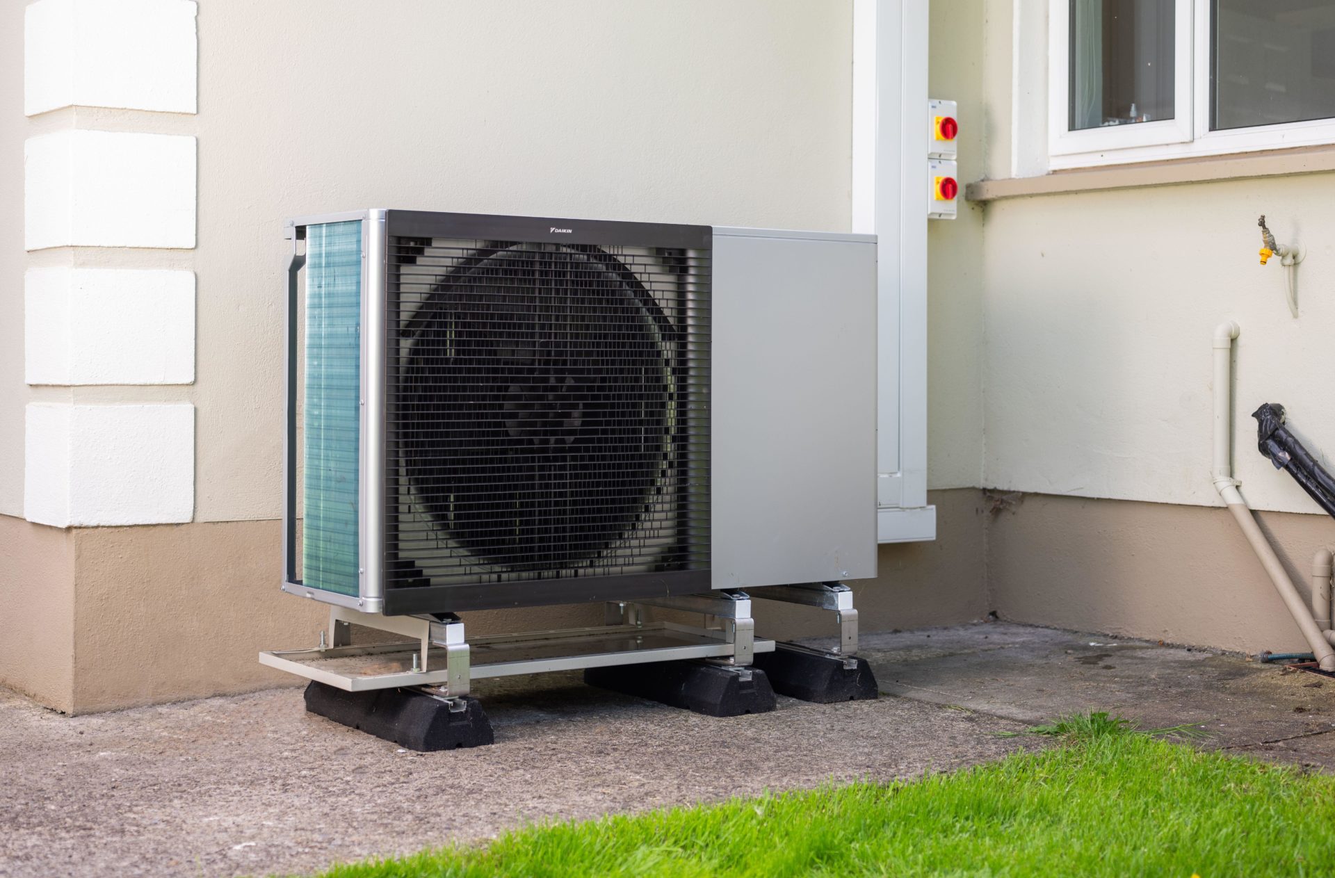 2XX3NH8 A heat pump installed in the garden of a home in Ireland.