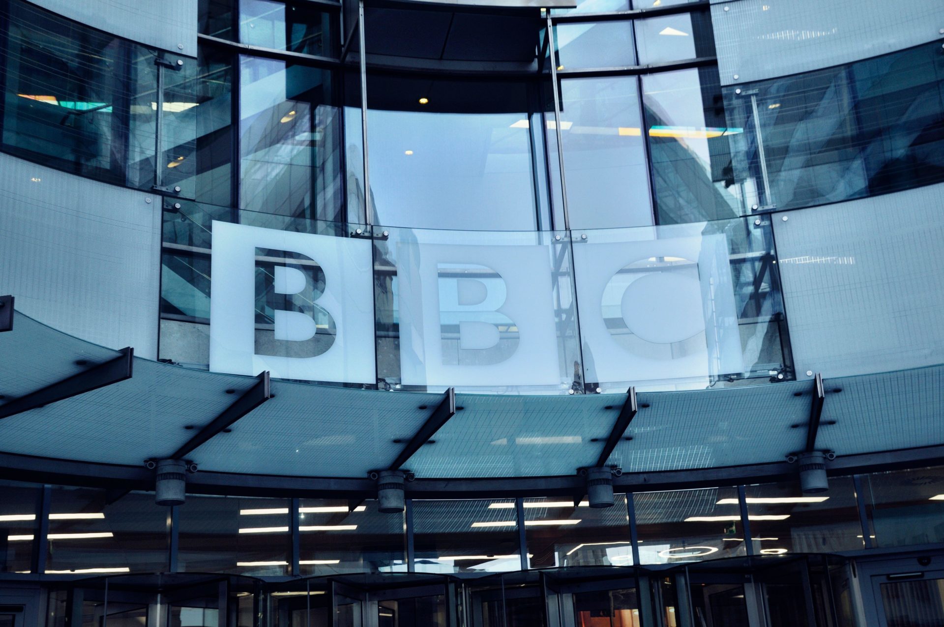 3DF68C7 BBC (British Broadcasting Corporation) logo above the entrance of its headquarters at Broadcasting House, Portland Place, Central London, England, UK