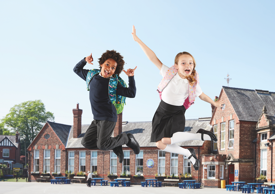 A child and child jumping in the air Description automatically generated with low confidence